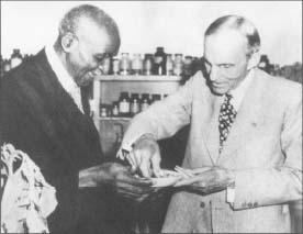 George Washington Carver, left, and industrialist Henry Ford share a weed sandwich in this 1942 photograph.