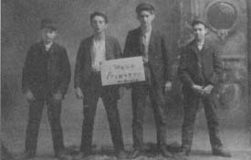 Holding a sign stating "We're Printers, by gravy," these young men had their photograph taken in the mid-1890s, possibly to commemorate the end of their apprenticeships. (From the collections of Henry Ford Museum & Greenfield Village.)