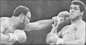 Joe Frazier throwing a punch at Muhammad Ali.